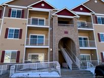 Exterior of a modern apartment building with stairs and accessible entrance at 15700 E Jamison Dr # 5-307, Englewood, CO 80112