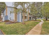 View of the condos, showcasing well-maintained grounds and classic architectural details at 8335 Fairmount Dr # 7-207, Denver, CO 80247