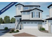 Under construction; charming two-story home showcasing a crisp white color palette and a spacious two-car garage at 22043 E 38Th Pl, Aurora, CO 80019
