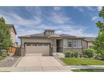 Charming home with stone accents, solar panels, a two-car garage and well maintained lawn at 4343 E 96Th Way, Thornton, CO 80229