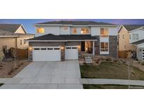Beautiful two-story home with a two-car garage and modern design elements at 14373 Shasta Daisy Pt, Parker, CO 80134