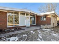 Charming brick home with large windows and modern design at 8280 E 104Th Way, Henderson, CO 80640