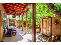 Inviting outdoor patio features a covered dining area and access to a beautifully landscaped garden at 807 9Th St, Golden, CO 80401