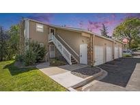 Inviting home featuring a two-story layout, garages, and individual entrances for each unit at 360 S Estes St # C, Lakewood, CO 80228