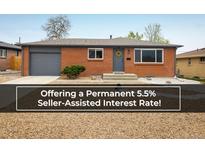 Charming single story brick home with grey trim, well maintained landscaping, and a welcoming front entrance at 740 Lotus Way, Broomfield, CO 80020