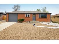 Charming brick ranch home with a well-kept yard and a cozy, welcoming entrance at 740 Lotus Way, Broomfield, CO 80020