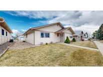 Inviting single-story home featuring a well-maintained lawn and charming curb appeal at 23 Carla Way, Broomfield, CO 80020