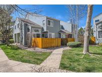 Charming two-story home with a well-manicured lawn and a wooden fence, nestled in a tranquil neighborhood at 5128 Buckingham Rd, Boulder, CO 80301
