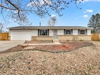 Charming single-story home featuring a well-maintained lawn and a two-car garage at 3118 S Joplin Ct, Aurora, CO 80013