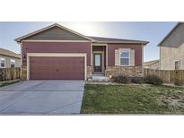 Charming single-Gathering home with a well-maintained lawn and two car garage at 7261 Ellingwood Ave, Frederick, CO 80504
