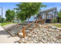 Charming two-story home with a landscaped front yard and inviting entrance at 3306 S Logan St, Englewood, CO 80113
