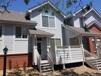 Charming townhome showcasing traditional architecture and inviting front porch at 2240 S Pagosa Ct # B, Aurora, CO 80013