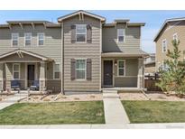 Charming two-story townhouse showcasing a well-maintained lawn and inviting facade with a welcoming walkway at 4358 S Nepal Ct, Centennial, CO 80015