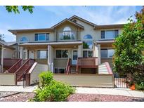 Inviting townhouse with well-maintained front yard and charming curb appeal at 584 Ridgeview Dr, Louisville, CO 80027