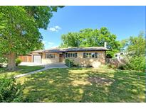 Charming single-story home featuring a well-maintained lawn and a welcoming entrance at 892 S Union Blvd, Lakewood, CO 80228