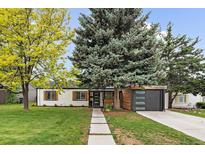 Charming single-story home with a well-maintained lawn and mature trees offering shade at 2865 S Cherry Way, Denver, CO 80222