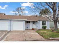 Charming single-story home with a well-maintained lawn and attached single-car garage, located on a quiet street at 16120 E Radcliff Pl, Aurora, CO 80015
