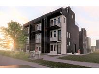 Modern three-story townhome building with sleek design and private balconies at 5128 W 26Th Ave # 208, Denver, CO 80212