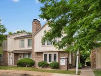 Charming two-story townhome with brick accents, mature landscaping, and a classic chimney at 3086 W 107Th Pl # F, Westminster, CO 80031