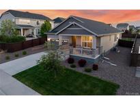 Charming single-Gathering home featuring a welcoming front porch and well-maintained landscaping at 14431 Forest St, Thornton, CO 80602