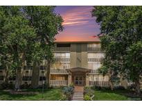 Charming condo building at 350 S Clinton St with manicured front lawn and mature shade trees at 350 S Clinton St # 2A, Denver, CO 80247