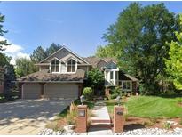 Charming two-story home with a well-manicured lawn and a two-car garage at 3 Winged Foot Way, Littleton, CO 80123