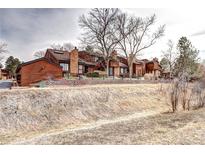 Charming townhomes feature brick accents and mature trees at 2685 S Dayton Way # 141, Denver, CO 80231