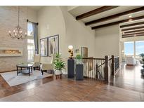 Grand entryway with high ceilings and open staircase at 10510 Ladera Dr, Lone Tree, CO 80124