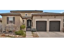 Two-story house with a three-car garage and landscaping at 10510 Ladera Dr, Lone Tree, CO 80124