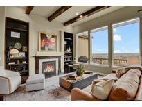 Spacious living room with fireplace and stunning views at 10510 Ladera Dr, Lone Tree, CO 80124