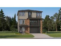Two-story home featuring stone accents, a two-car garage, a balcony, and professionally landscaped front yard at 7740 S Cherokee Trl, Centennial, CO 80016