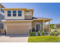Two-story home showcasing a modern exterior, neat landscaping, and a two-car attached garage at 3130 Hardin St, Castle Rock, CO 80109