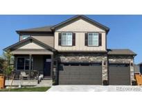 Inviting two-story home with a covered front porch and a three-car garage at 1923 Westport Ave, Berthoud, CO 80513