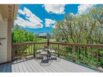 Lovely backyard view from the deck with table and chairs, perfect for entertaining at 6334 Cherokee Dr, Sedalia, CO 80135
