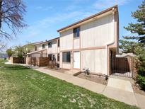 Charming townhouse with a well-maintained lawn and appealing exterior features at 10248 Quivas St, Thornton, CO 80260