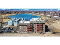 Stunning aerial view of a lakeside community with easy access to a major highway and mountain views at 3047 W 47Th Ave # 110, Denver, CO 80211