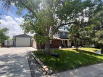 Charming two-story home with well-maintained lawn and mature trees at 1158 E Easter Ct, Centennial, CO 80122