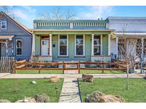 Charming home featuring inviting front porch, garden, and well-manicured lawn at 3726 N High St, Denver, CO 80205