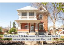 Charming two-story red brick home with a covered front porch and well-maintained landscaping at 3905 Tejon St, Denver, CO 80211