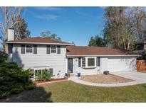 Charming two-story home with a well-manicured lawn, bay window, a driveway, and a two-car garage at 4374 E Peakview Cir, Centennial, CO 80121