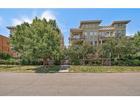 Beautiful condo building with manicured landscaping and lovely balconies at 1521 Vine St # 101, Denver, CO 80206