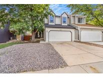 Charming two-story home featuring a spacious two-car garage and well-maintained gravel front yard at 3713 S Ensenada St, Aurora, CO 80013