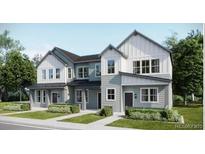 Charming gray two-story home with well-manicured landscaping and lots of windows at 6578 E 149Th Ave # 3, Thornton, CO 80602
