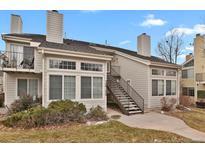 Charming multi-level exterior with a private entrance, featuring well-maintained landscaping and a cozy balcony at 13732 E Lehigh Ave # H, Aurora, CO 80014