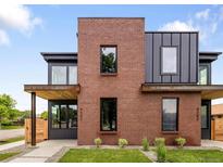 Modern two-story home showcases a striking brick facade and dark metal accents at 4301 Osceola St, Denver, CO 80212