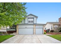 Charming two-story home featuring a three-car garage and lovely landscaping at 4982 S Danube St, Aurora, CO 80015