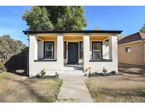 Charming remodeled bungalow with a covered porch and well-manicured landscaping at 720 Raleigh St, Denver, CO 80204