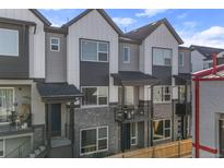 Charming townhouse featuring a mix of modern materials with covered porches for outdoor enjoyment at 5173 Vivian St, Wheat Ridge, CO 80033