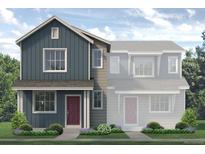 Charming two-story home featuring a combination of navy and grey siding, crisp white windows and well-manicured landscaping at 1484 Coral Pl, Longmont, CO 80504