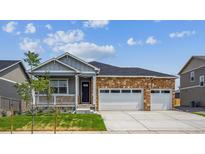 Charming single-story home featuring stone accents and a convenient two-car garage at 1144 Ridgefield Dr, Berthoud, CO 80513